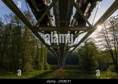 Bottom view to heat line bridge with tree. Industry architecture in landcape Stock Photo