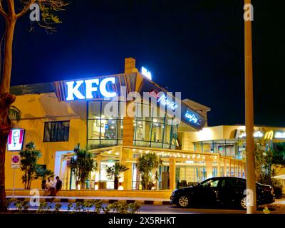 Cairo, Egypt, April 26 2024: Kentucky Fried Chicken restaurant KFC at night in New Cairo city, an American fast food restaurant chain headquartered in Stock Photo