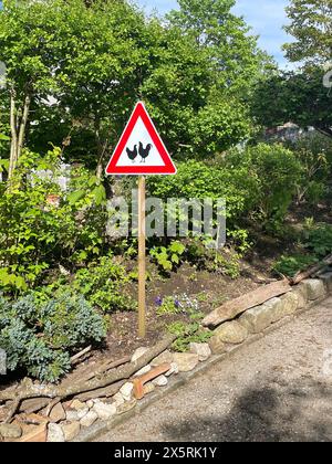 Roadside attention sign for free running chickens,  Bavaria, Germany. Photo by Willy Matheisl Stock Photo