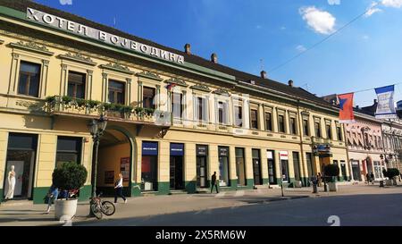 Novi Sad, Serbia 30 April 2022 Hotel Vojvodina is the oldest hotel in the center of the city. European tourism facility. Street with passers-by. Freed Stock Photo