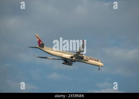 Doha, Qatar - May 03, 2024: Qatar Airways Boeing 737 Max 8 Landing Hamad Airport Stock Photo