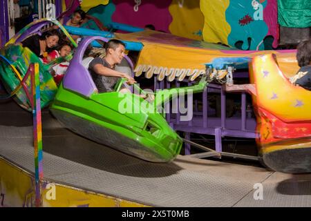 Oaxaca, Mexico, North America.  Day of the Dead Celebrations.  Amusement Ride outside entrance to San Miguel Cemetery. Stock Photo
