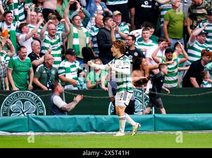 Celtic's Kyogo Furuhashi celebrates after Rangers' John Lundstram (not pictured) scores an own goal during the cinch Premiership match at Celtic park, Glasgow. Picture date: Saturday May 11, 2024. Stock Photo