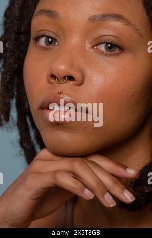 Portrait of young woman wearing face piercing Stock Photo