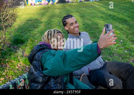 Young male friends taking selfie outdoors Stock Photo