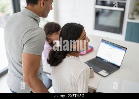 Father helping his daughters with homework Stock Photo - Alamy