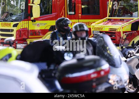 Ratingen, Germany. 11th May, 2024. Several motorcycles ride past fire station vehicles. One year after an explosion in a high-rise building in Ratingen near Düsseldorf that injured 35 people, bikers have drawn attention to the suffering of the victims with a motorcycle rally. Credit: David Young/dpa/Alamy Live News Stock Photo