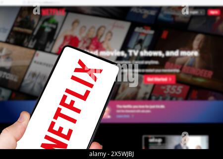 Stuttgart, Germany - May 1, 2024: Netflix logo online video streaming service on a mobile phone and computer in Stuttgart, Germany. Stock Photo