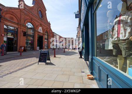 Old man waiting outside a shop Stock Photo