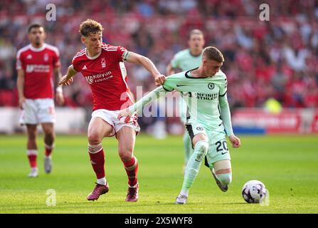 Nottingham Forest's Ryan Yates (left) and Chelsea's Cole Palmer battle for the ball during the Premier League match at City Ground, Nottingham. Picture date: Saturday May 11, 2024. Stock Photo