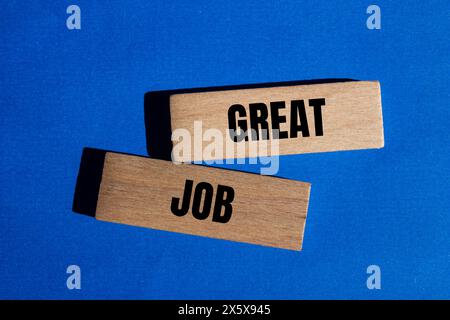 Great job written on wooden blocks with blue background. Conceptual great job symbol. Copy space. Stock Photo