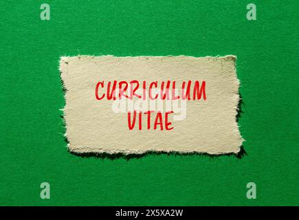 Curriculum vitae words written on ripped paper with green background. Conceptual curriculum vitae CV symbol. Copy space. Stock Photo