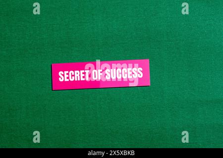 Secret of success words written on pink paper sticker with green background. Conceptual secret of success symbol. Copy space. Stock Photo