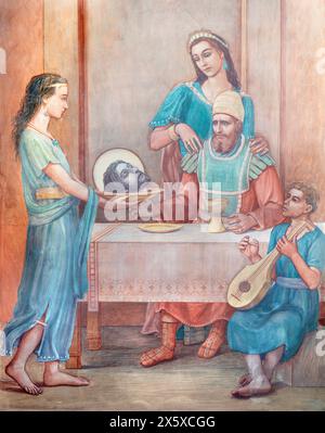 MILAN, ITALY - MARCH 7, 2024: The fresco Salome presents scale with the head of John the Baptist to Herodes and Herodias in church Chiesa di San Vito Stock Photo