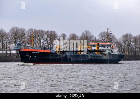 Hamburg, Germany - 01 23 2024:View of the suction dredger ship Ijsseldelta on the Elbe in Hamburg. Stock Photo