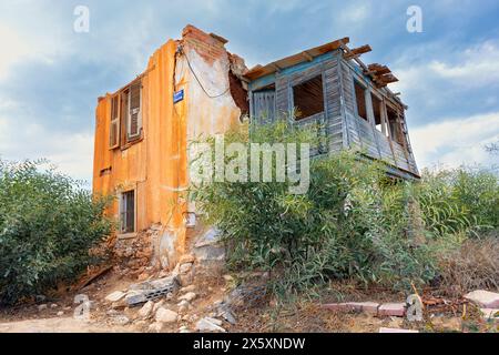 Varosha-Northern Cyprus:October 18, 2023: One of the hundreds of ruinous buildings in the abandoned city of Varosha | Kapali Maras, Famagusta, Norther Stock Photo