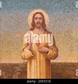 MILAN, ITALY - MARCH 6, 2024: The mosaic of Heart of Jeus in the church Basilica di Santa Eufemia by unknown atist. Stock Photo