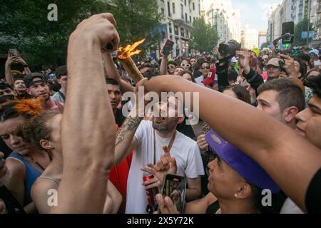 Madrid, Spain. 11th May, 2024. A man smokes a large marijuana cigarette during the World Marijuana March. On the occasion of the celebration of the World Marijuana March, hundreds of people have protested in the center of Madrid against the strict regulations that continue to exist against the cultivation and possession of marijuana. This march has been taking place since 1999 and more than 700 cities around the world participate. Credit: SOPA Images Limited/Alamy Live News Stock Photo