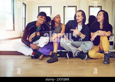 Studio, dancers or friends in portrait while happy for practice break, resting or relaxing together. Dancing school, crew or talent people with skills Stock Photo