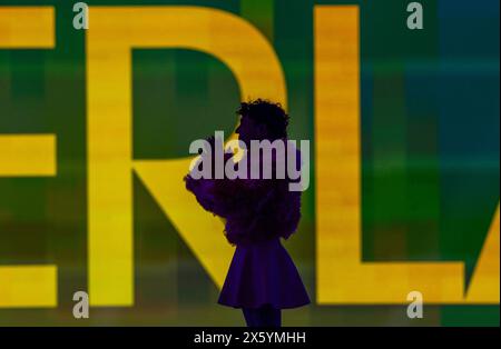 Malmo, Sweden. 12th May, 2024. Nemo from Switzerland sings his song 'The Code' after winning the final of the Eurovision Song Contest (ESC) 2024. In the world's biggest singing competition under the motto 'United By Music', 25 countries compete against each other in the final. Photo: Jens Büttner/dpa Credit: dpa picture alliance/Alamy Live News Stock Photo