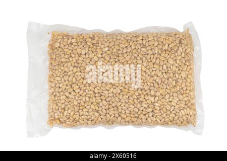 Cedar nuts in plastic bag isolated on white background. Transparent vacuum package of pine nuts. Top view, Stock Photo