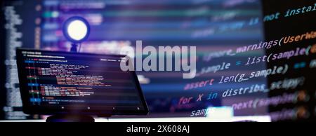 Work from home. Programmer coding code on notebook screen at Stock Photo