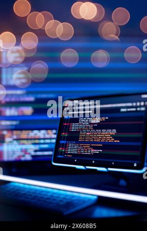 Work from home. Programmer coding code on notebook screen at Stock Photo