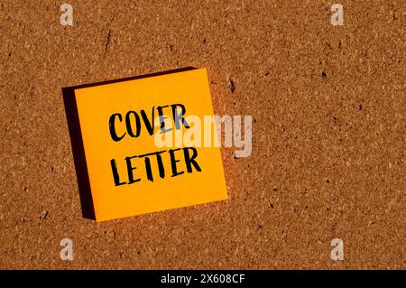 Cover letter words written on orange paper sticker with brown background. Conceptual cover letter symbol. Copy space. Stock Photo