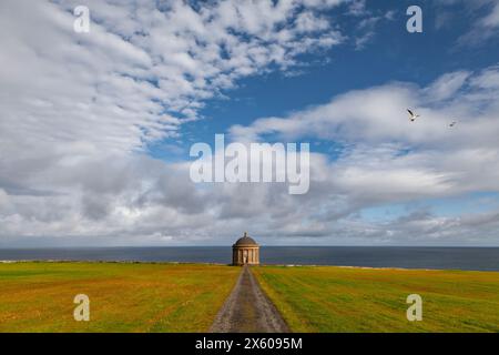 The Mussenden Temple overlooking the Atlantic Ocean and Downhill Strand, in County Derry, Northern Ireland. Stock Photo