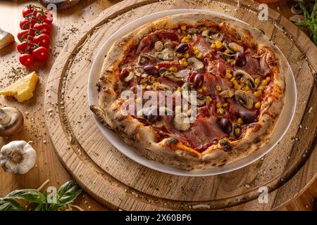 Capricciosa pizza made of ham and mushrooms. Italian pizza concept Stock Photo