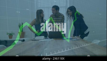 Image of graph with changing numbers over diverse coworkers discussing reports on laptop Stock Photo