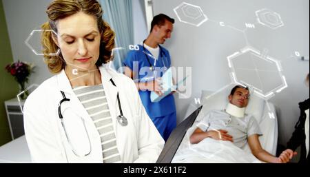 Image of chemical structures against caucasian female doctor reading medical reports at hospital Stock Photo