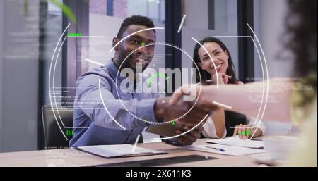Image of circles and computer language over diverse entrepreneurs discussing and shaking hands Stock Photo