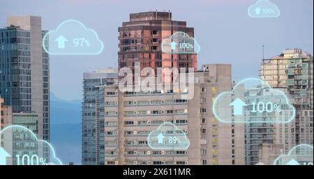 Image of digital clouds with percent going up over cityscape Stock Photo