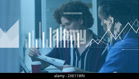 Image of statistical data processing over two diverse man discussing over a document at office Stock Photo