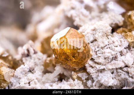 Vesuvianite crystal, from Mexico. macro photography detail texture background. close-up raw rough unpolished semi-precious gemstone Stock Photo