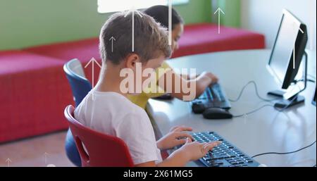 Image of up arrows over diverse boys learning to use computer in school Stock Photo