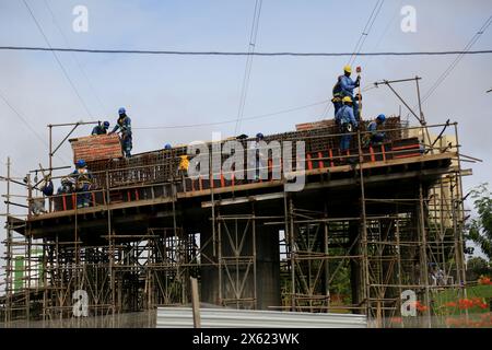 salvador, bahia, brazil - april 22, 2024: construction workers are seen moving the structure for a viaduct in the city of Salvador. Stock Photo