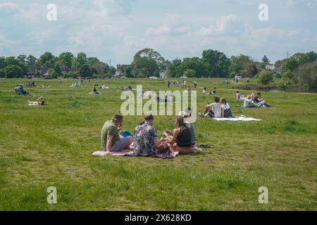 Wimbledon, London, UK. 12 May, 2024.  People relaxing on Wimbledon Common, south west London.  Today is predicted to be the hottest day of the year so far with temperatures  peaking at  27C. Credit: amer ghazzal/Alamy Live News Stock Photo
