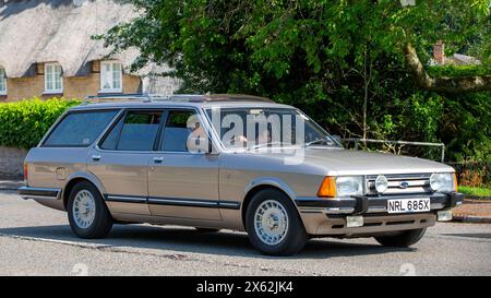 Milton Keynes,UK - May 5th 2024: 1982 Ford Granada ghia classic car driving on a British road Stock Photo