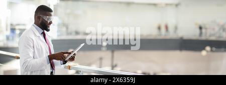 African american medical scientist using digital tablet, copy space Stock Photo