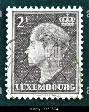 Postage stamp printed by Luxembourg, that shows portrait of Charlotte, circa 1948. Stock Photo