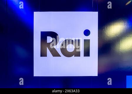 Turin, Italy - May 10, 2024: Logo of RAI Radio Televisione Italiana on a wall sign with light blue and yellow spot reflections. RAI is the Italian rad Stock Photo