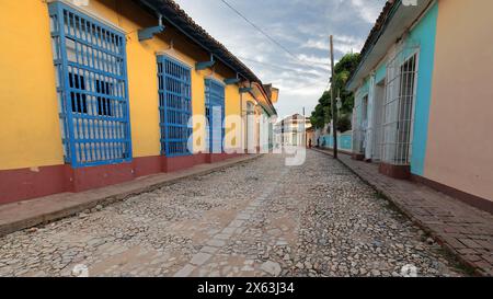 280Colorist colonial houses framing the cobbled Calle Real de Jigue Street, up to Plaza Mayor Square and Casa Aldeman Ortiz House. Trinidad-Cuba. Stock Photo