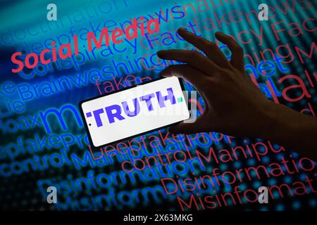 Brussels, Belgium. 12th May, 2024. The TikTok logo is displayed on a smartphone with social media - disinformation wordle visible in the background in this photo illustration.Taken in Brussels, Belgium. On May 11, 2024. (Jonathan Raa/Sipa USA) *** Strictly for editorial news purposes only *** Credit: Sipa USA/Ģ����ý Live News Stock Photo