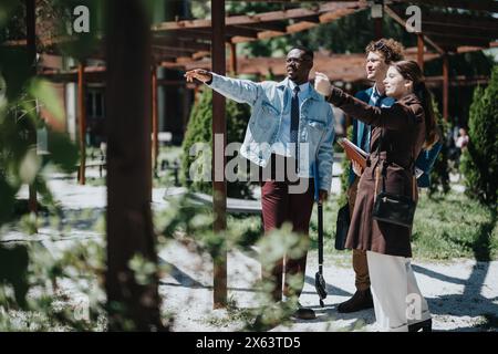 Diverse business team collaborates on new ideas in an outdoor urban setting Stock Photo
