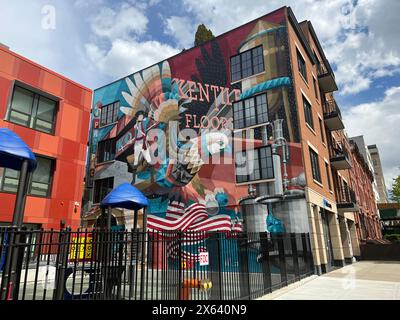 A mural by by Dutch artist Eelco “Virus” van den Berg along the side of the The Ninth, a 10-apartment rental by Volmar Construction at 203 Ninth Street pays homage to the Gowanus neighborhood with nods to Kentile Floors sign, The Daily News plant, the RKO Prospect Theater, and the Maryland 400, the Revolutionary War heroes who may be burned in a mass grave in the neighborhood. Stock Photo