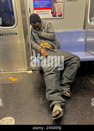 A man sleeps while riding a New York City subway in Manhattan Stock ...
