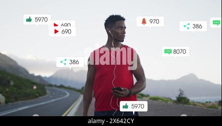 Image of notification bars over african american athlete standing and listening to music Stock Photo