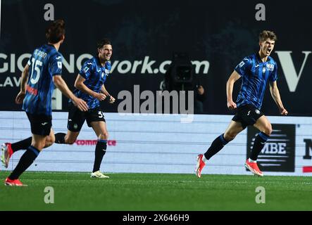 Bergamo, Italy. 12th May, 2024. Atalanta's Charles De Ketelaere (R) celebrates his goal during a Serie A soccer match between Atalanta and Roma in Bergamo, Italy, May 12, 2024. Credit: Alberto Lingria/Xinhua/Alamy Live News Stock Photo